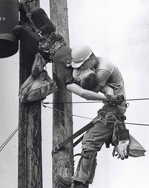 Lineman performs artificial respiration on his electrocuted co-worker. Kiss Of Life (1967)